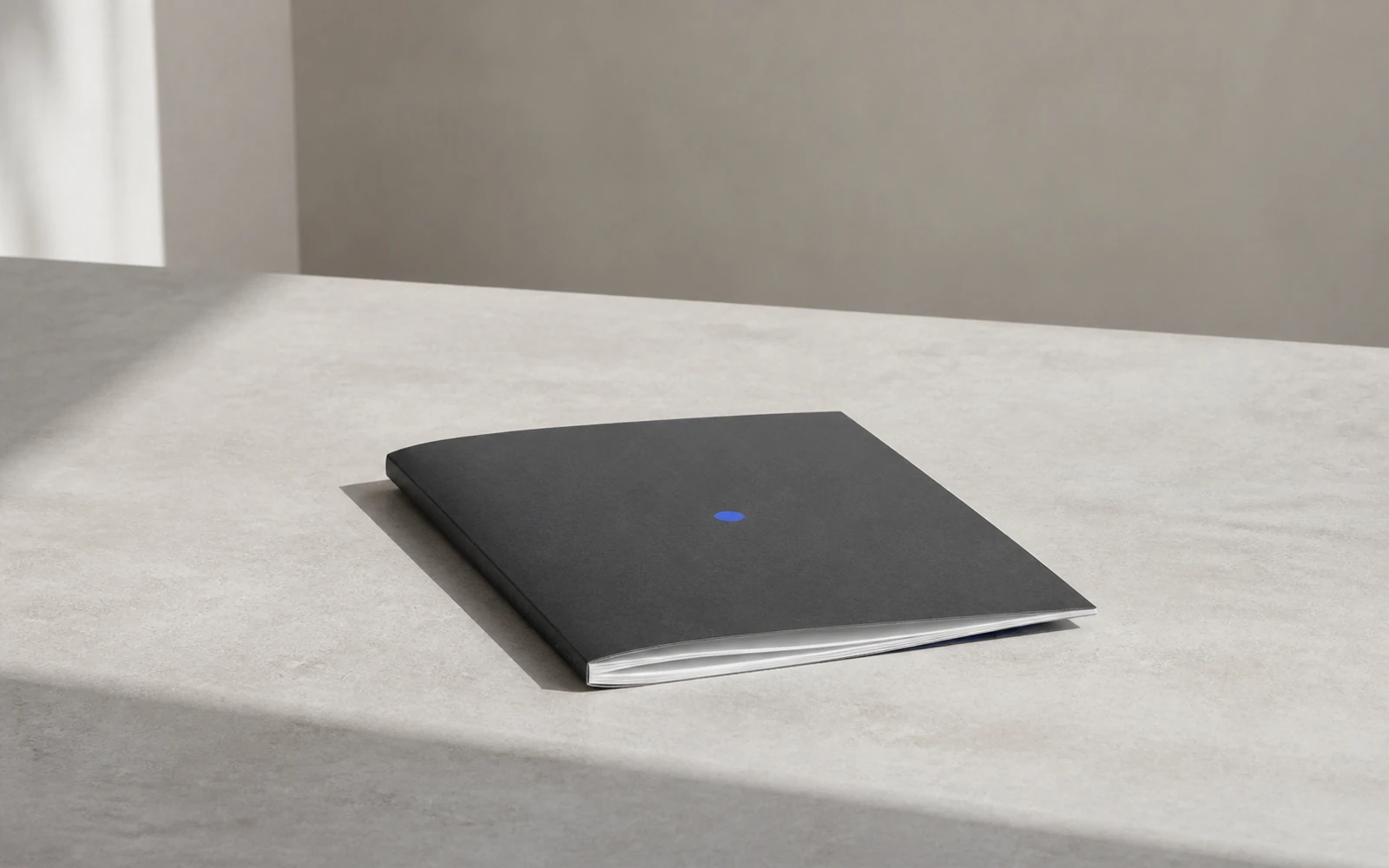 A single workbook on a table, with no other course materials beside it